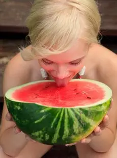Beautiful Blonde Feeona Eats A Watermelon While Posing Naked On Lakeside Dock