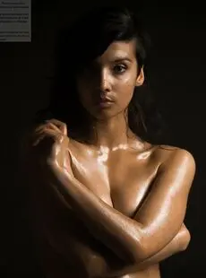 Naked Indian Female Exposes A Single Breast While Modeling In The Dark