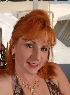Older Redhead Removes Her Dress And Pretties To Expose The Pinkest Pussy Going