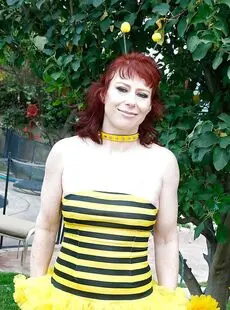 Outdoor Close Up Posing Of An Mature Slut With Red Short Hair