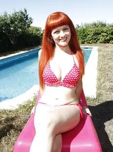 Redhead Latina Plays With Her Tits And Strips Off Her Bikini By The Pool
