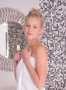 Young Looking Blonde Lauma Removes A Bath Towel Before Getting In The Bathtub