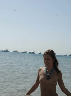 AMALANDmokingkinny chick nude on the beach
