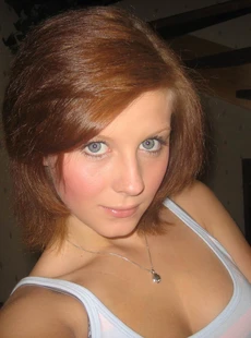 AMALAND redhead poses and gets naked